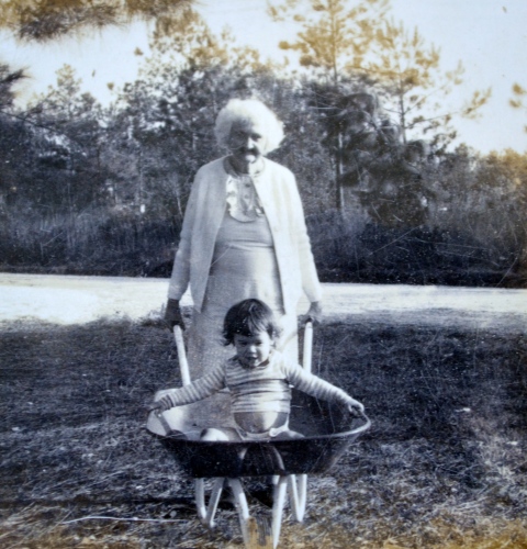 My great-grandmother, me, and my wheelbarrow